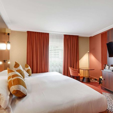 Nest Paris La Defense - Mgallery Puteaux Bagian luar foto A room at the hotel